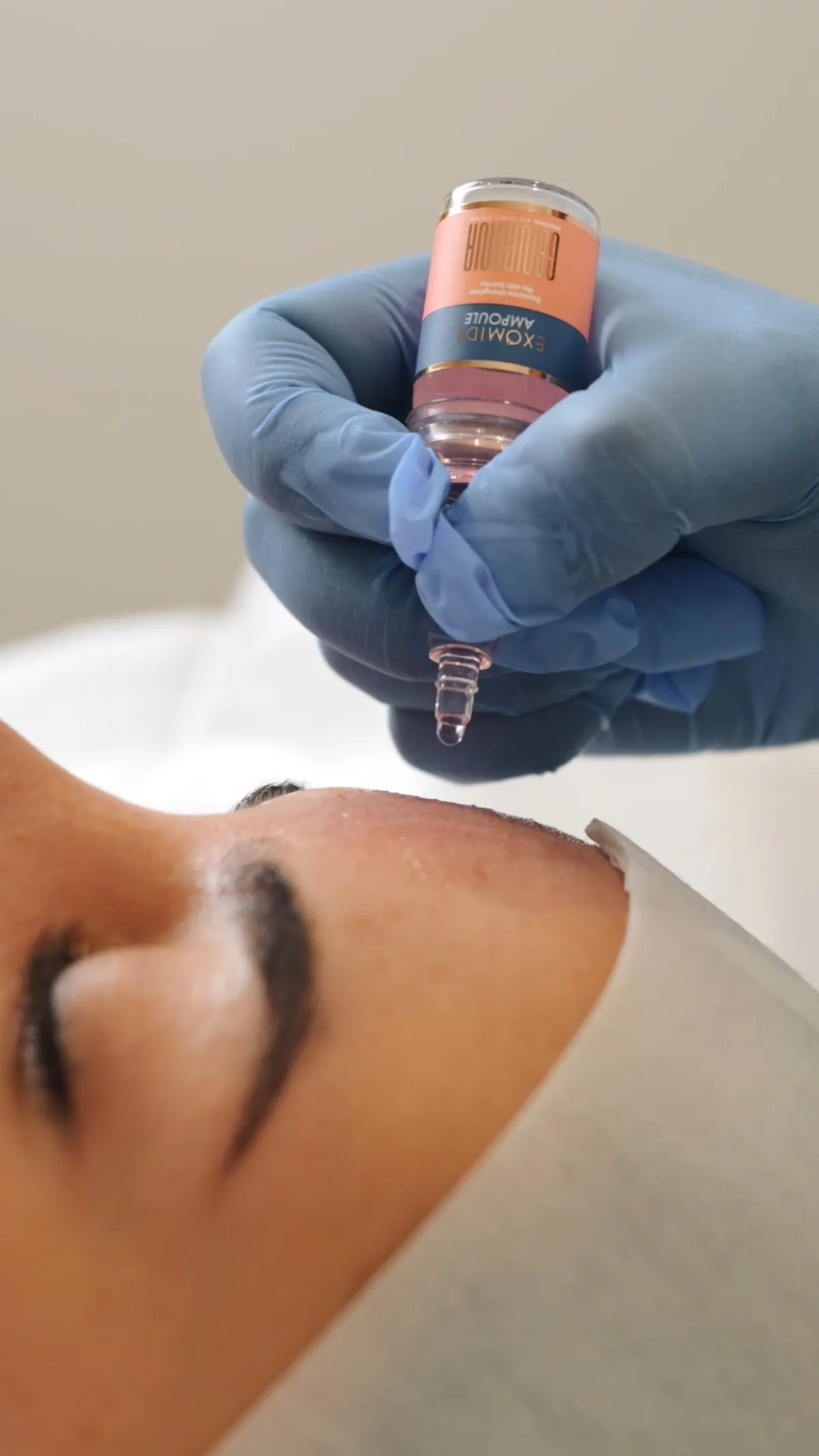 Exomide exosome ampoule applied during skin needling at Skin Therapy